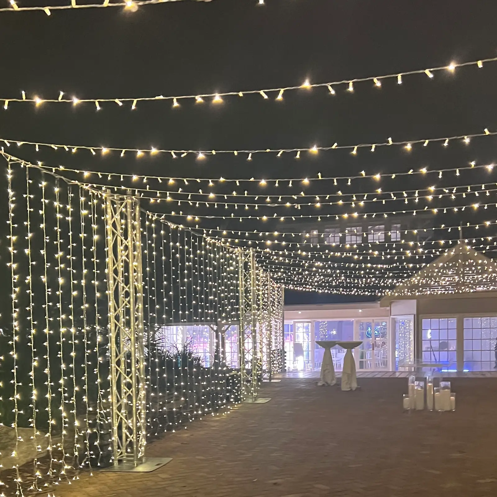 Stunning ceiling installation of fairy lights creating a starry night effect for indoor venues.