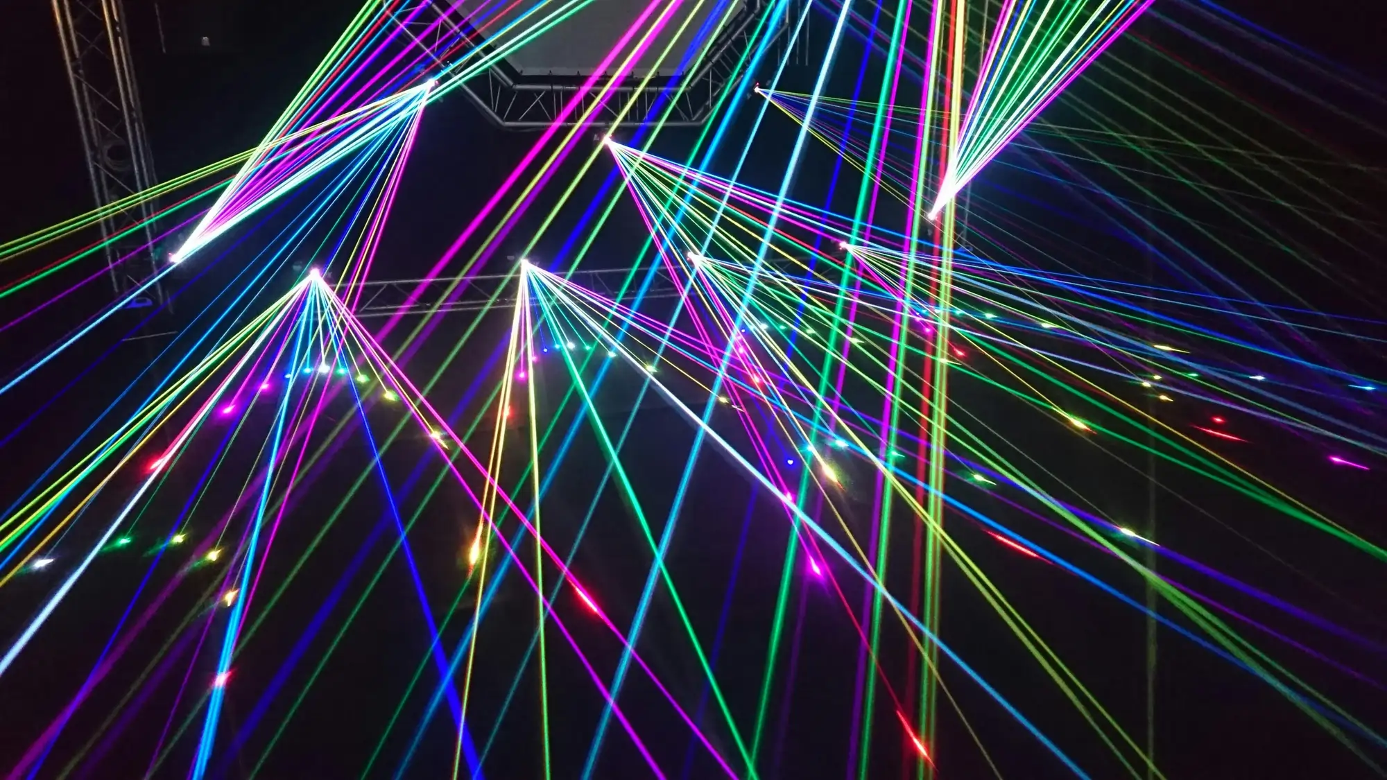 Dynamic laser light effects creating immersive experience for corporate product launches and high-energy events.