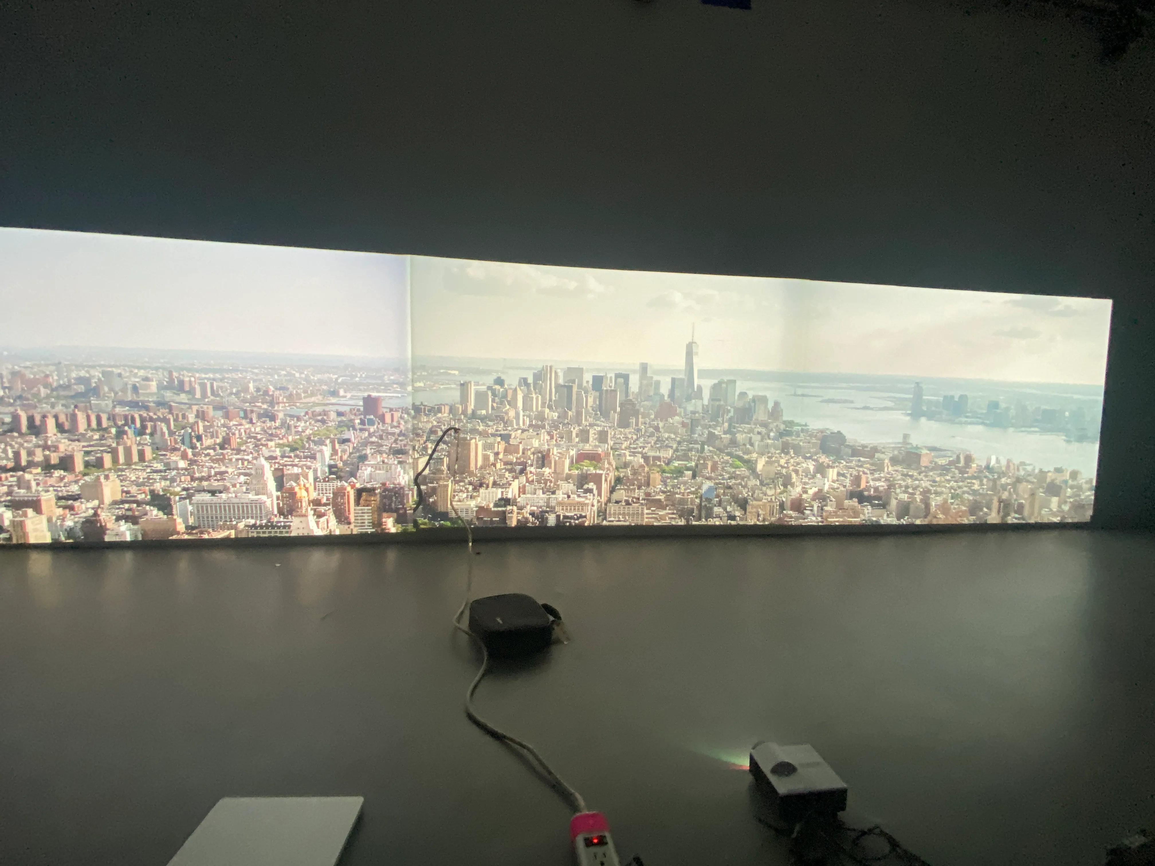 Wide panoramic projection mapped across a venue wall
