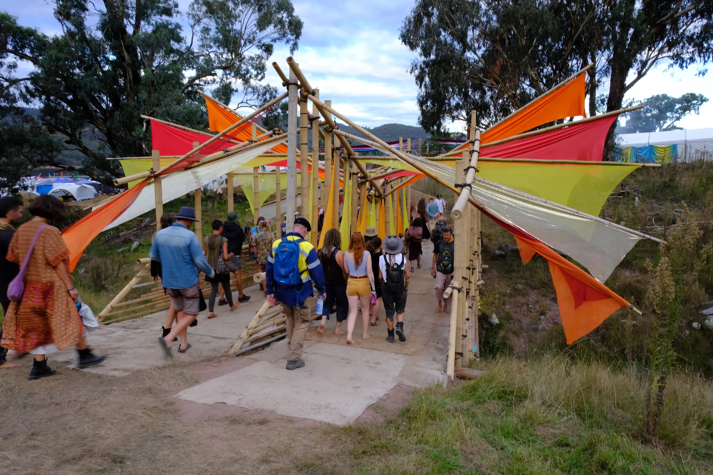 Crowd engaging with an interactive lighting experience at night
